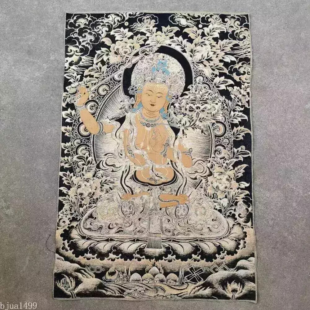 Handmade Caishen Buddha Wealth Deity Thangka Art: Size: Length 90 cm - Width 60 cm. Materials: Brocade, embroidery. Condition: Resembles a retro aesthetic. This vintage inspired Tibetan Thangka is a beautiful piece of Buddhist art crafted using embro