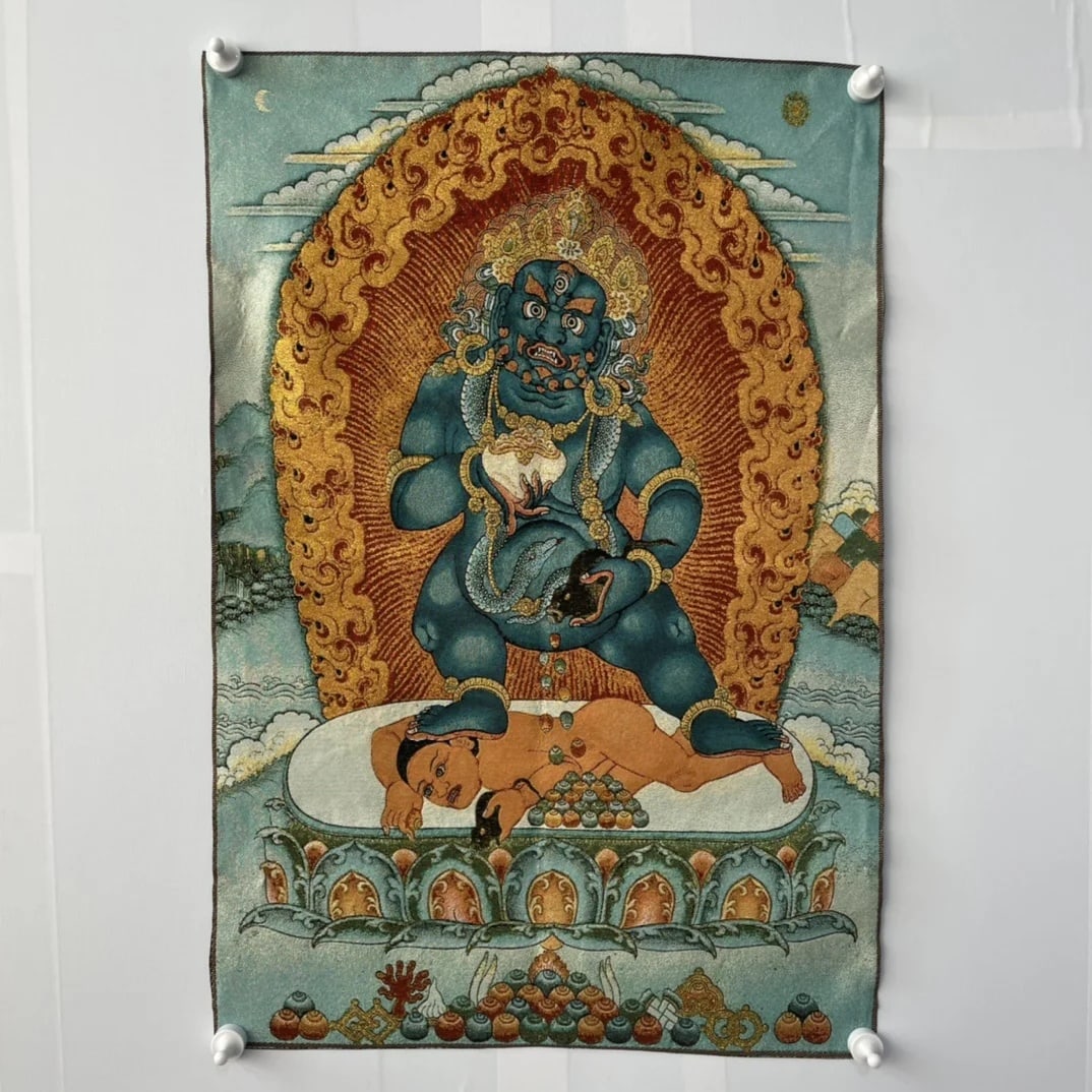 Tibetan Black Jambhala Wealth Deity Silk Decor: Size: Height 90 cm - Length 60 cm. Weight 0.2 kg. Materials: Embroidery, silk, textiles. Condition: Resembles a retro aesthetic. This retro-style Tibetan thangka is a beautiful work of Buddhist art, c