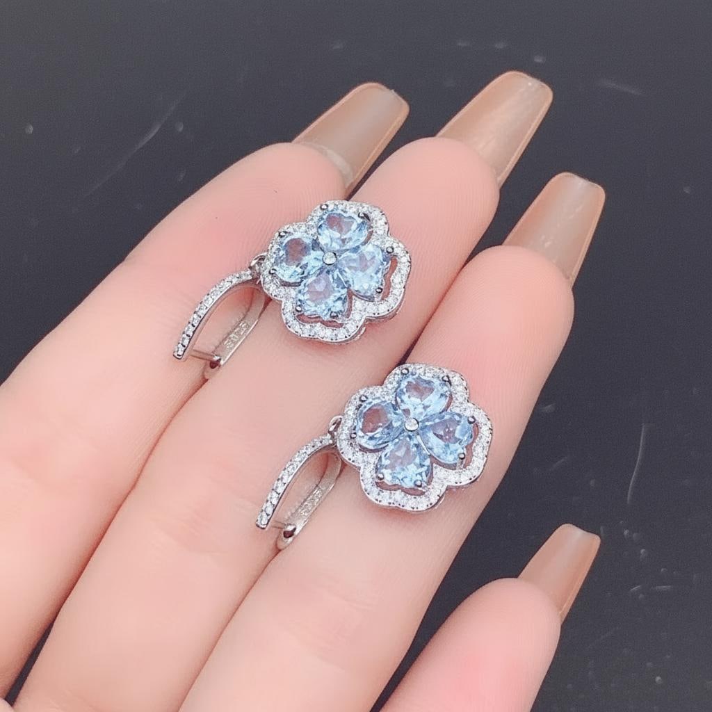 Blue Aquamarine Clover Drop Earrings Silver 925: Size: Stone size 5 mm. Weight 5 g. Materials: 925 sterling silver, platinum plating, aquamarine, zircon. Condition: New. This pair of earrings is crafted from 925 sterling silver and features a