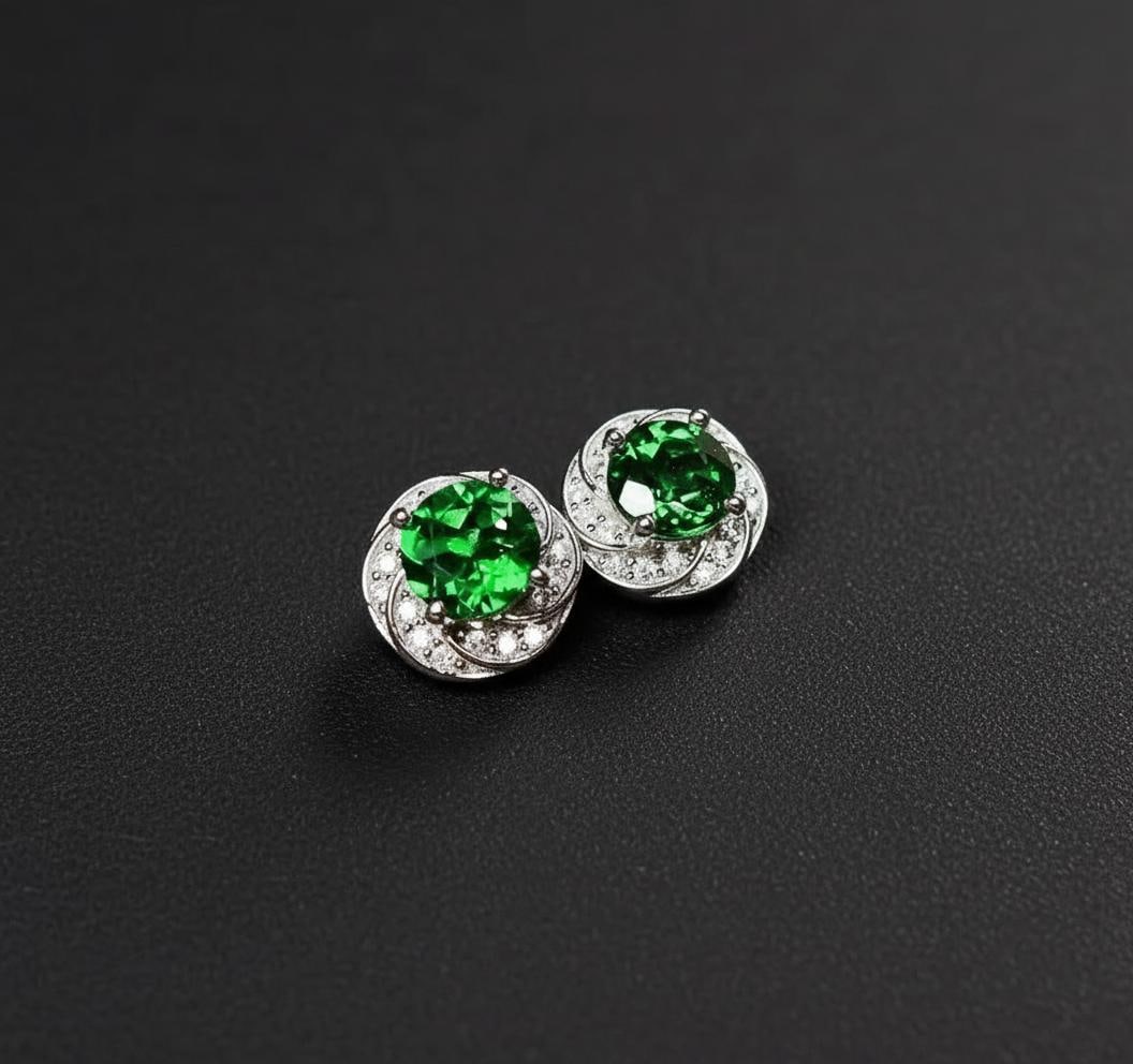 Green Diopside Stud Earrings 925 Silver Round Cut: Size: Stone size 5 mm. Weight 2 g. Materials: 925 sterling silver, diopside, zircon. Condition: New. This pair of stud earrings is crafted from 925 sterling silver and highlights round-cut green