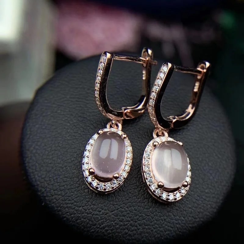 Oval Rose Quartz Drop Earrings Silver 925 Halo: Size: Stone size 8 x 6 mm. Weight 2 g. Materials: 925 sterling silver, platinum plating, rose quartz, zircon. Condition: New. This pair of dangle earrings is crafted from 925 sterling silver with