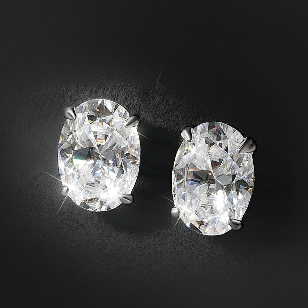 Rare Oval Cut Moissanite Stud Earrings 1ct Silver: Size: Stone 1 ct. Materials: 925 sterling silver, 18k gold plating, moissanite. Condition: New. This pair of stud earrings is crafted from 925 sterling silver with 18k gold plating and features