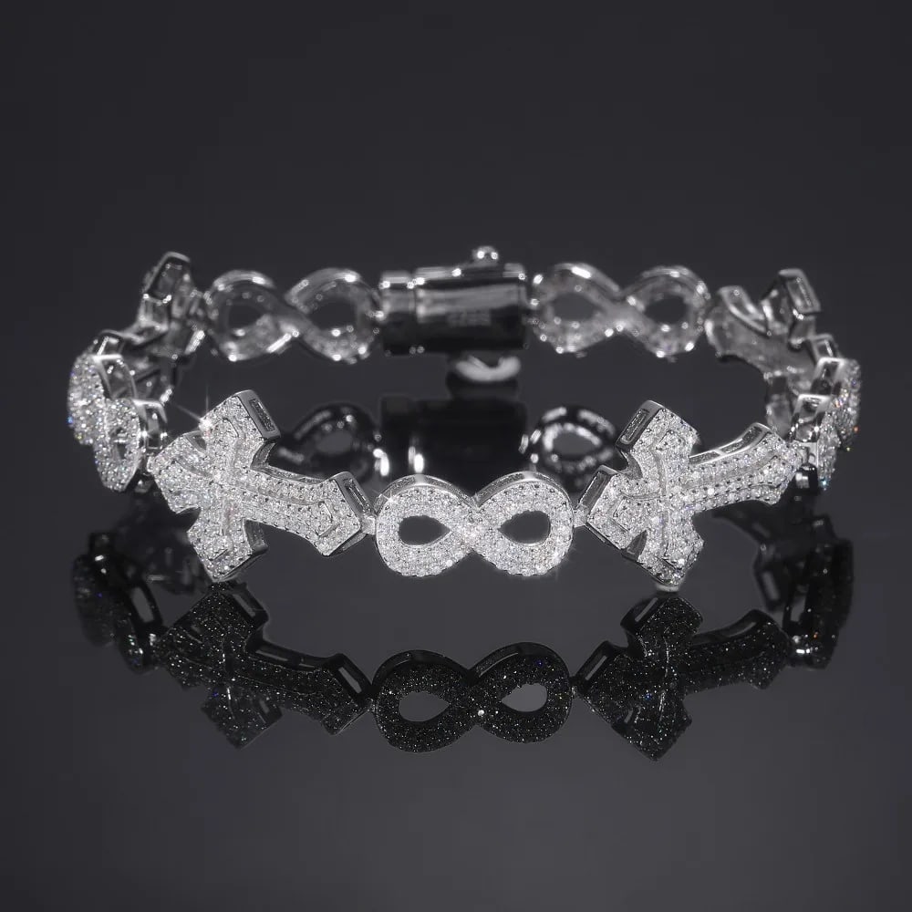 Cross Infinity Moissanite Link Bracelet Silver 925: Size: Length 18 cm - Width 15 mm. Weight 15 g. Materials: 925 sterling silver, white gold plating, moissanite. Condition: New. This bracelet features an intricate design of alternating cross and infin