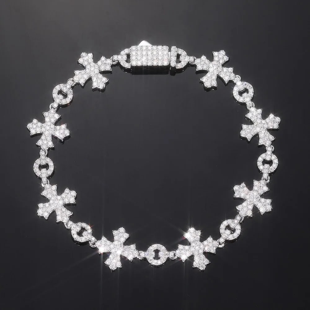Iced Out Moissanite Cross Bracelet 925 Silver: Size: Length 15 cm - Width 12 mm. Weight 12 g. Materials: 925 sterling silver, white gold plating, moissanite. Condition: New. This bracelet displays a series of interlocking cross and circle links, c