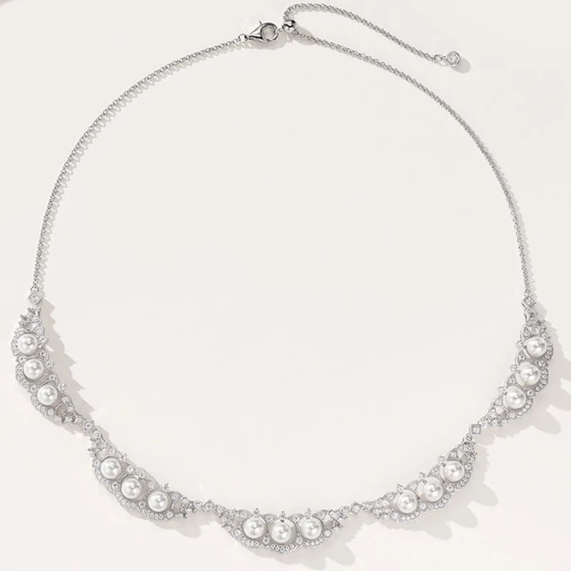 White Rice Pearl Necklace Sterling Silver Zircon: Size: Length 43 cm. Weight 30 g. Materials: 925 sterling silver, freshwater pearl, zircon. Condition: New. This necklace is crafted from 925 sterling silver and features a series of white rice-shaped
