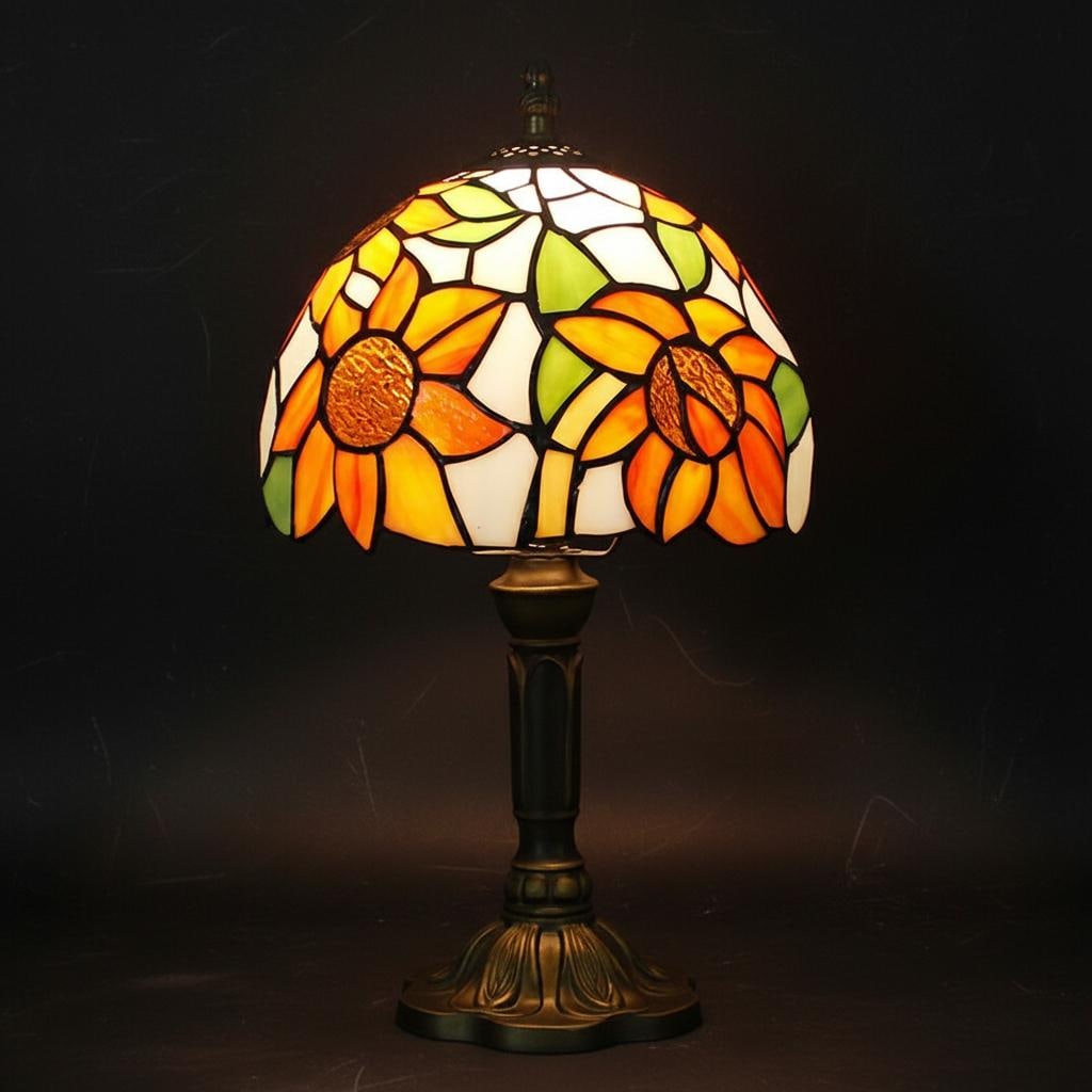 Vintage Tiffany Style Sunflower Glass Table Lamp: Size: Height 35 cm - Diameter 20 cm. Weight 2 kg. Materials: Stained glass, resin, shell. Condition: Excellent. This table lamp features a stained glass shade with a vibrant sunflower design in the Ti