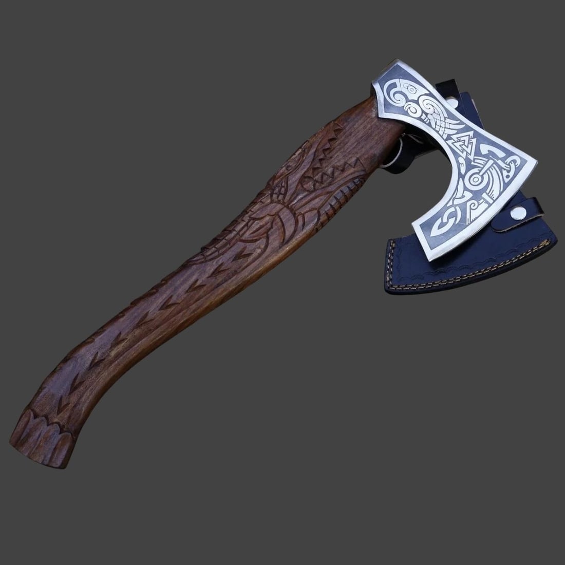 Carbon Steel Hand-Made Ornament Design Hatchet: Size: Total Length 53.3 cm - Blade Length 15.2 cm - Blade Width 17.8 cm - Handle Length 50.8 cm. Materials: Carbon steel, wood. Hardness: 58-60 HRC. Condition: New. This hand-made hatchet features a c