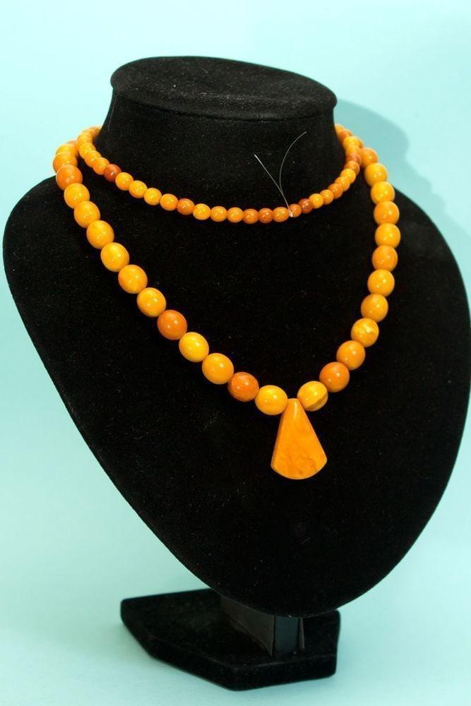 Natural Butterscotch & Egg Yolk Amber Pendant Necklace: 43g vintage natural Baltic amber necklace with a pendant, featuring a classic design that highlights the timeless elegance of genuine amber. Weight: 43 gram Pendant size: 7?23?32 Length: 820 mm (dress