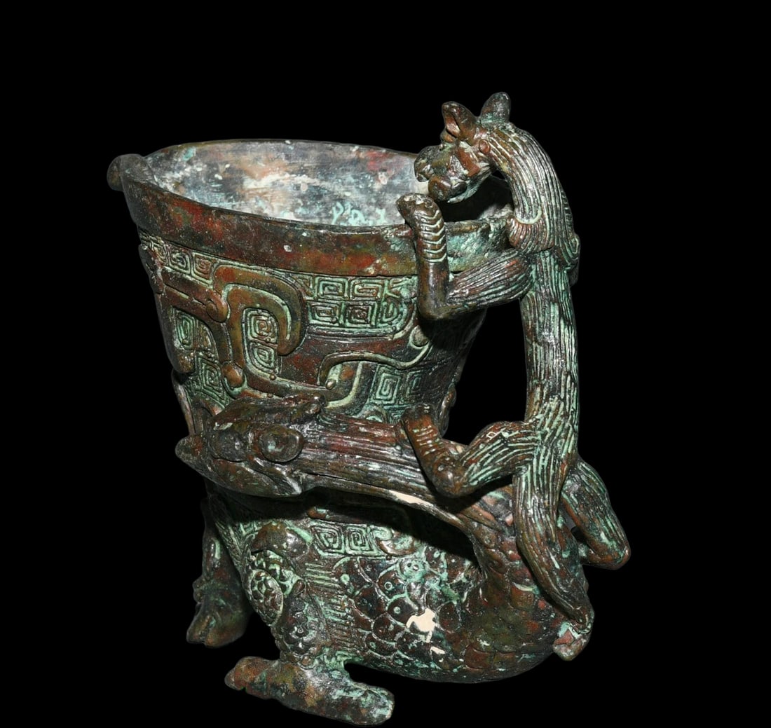 Mythic Beast Bronze Ritual Wine Cup Vintage Vessel: Size: Height 9.9 cm - Length 10.9 cm - Width 6.9 cm. Weight 1.6 kg. Materials: Bronze. Condition: Looks like vintage. This vessel, fashioned in the manner of Shang Dynasty bronze ware, is a captivatin