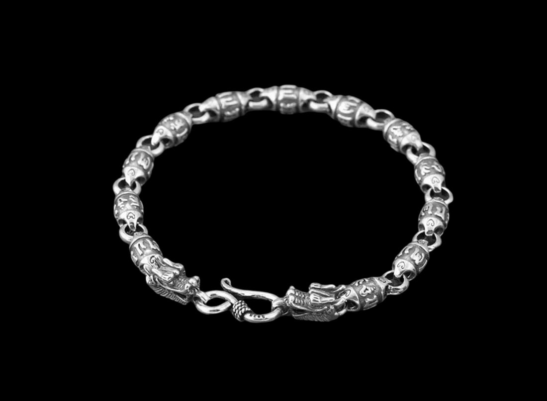 Sacred Script Mythic Silver Barrel Link Armlet: Size: Length 18.5 cm - Width 0.6 cm. Weight 15 g. Materials: S925 Silver. Condition: New. This bracelet, fashioned in the manner of traditional Buddhist-inspired jewelry, is a captivating and intricat
