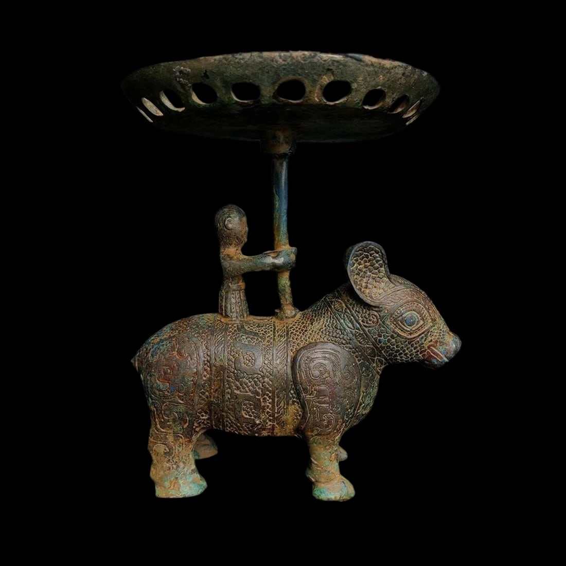 Archaic Style Bronzed Beast Donkey Candlestick: Size: Height 21 cm - Length 19 cm. Weight 1.9 kg. Materials: Bronze. Condition: Excellent. This intriguing bronze candlestick is cast in the shape of a kneeling figure supporting a mythical beast, ref