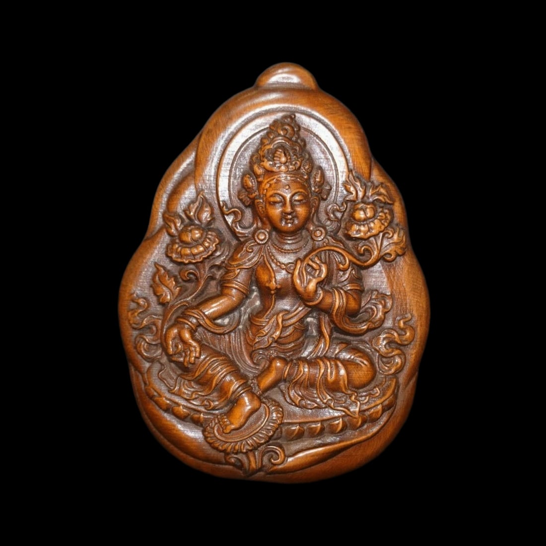 Antique Style Boxwood Green Tara Buddha Amulet: Size: Height 7.9 cm - Length 5.8 cm - Width 2 cm. Weight 0.6 kg. Materials: Boxwood. Condition: Looks like vintage. This piece is fashioned in the manner of a sacred devotional talisman, featuring a h