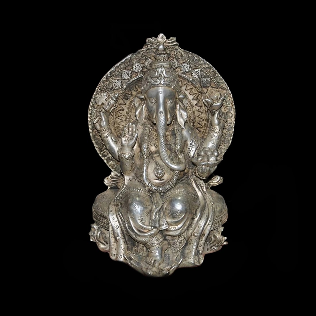 Tibetan Silver Elephant Head Motif Buddha Figurine: Size: Height 17 cm - Length 12 cm - Width 11 cm. Weight 1.9 kg. Materials: Tibetan Silver (alloy of tin with copper or zinc). Condition: Appears to have a classic aesthetic. This powerful spiritual st