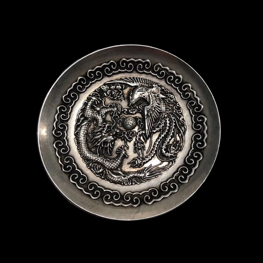Antique Style Tibetan Silver Longfeng Chengxiang Plate Round Shape: Size: Height 2 cm - Diameter 10 cm. Weight 150 g. Materials: Silver plated copper Condition: Excellent This plate features intricate engravings of a dragon and a phoenix, symbolizing auspicious harmon