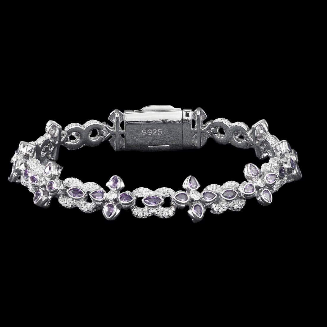 925 SIlver Purple Stones Bracelet Cross Shaped: Size: Lenght 19 cm - Width 10.5 mm. Weight: 23.51 g. Materials: S925 silver, CZ. Condition: New. This sterling silver Infinity Cross Bracelet is a masterfully crafted piece of jewelry with a bold, str