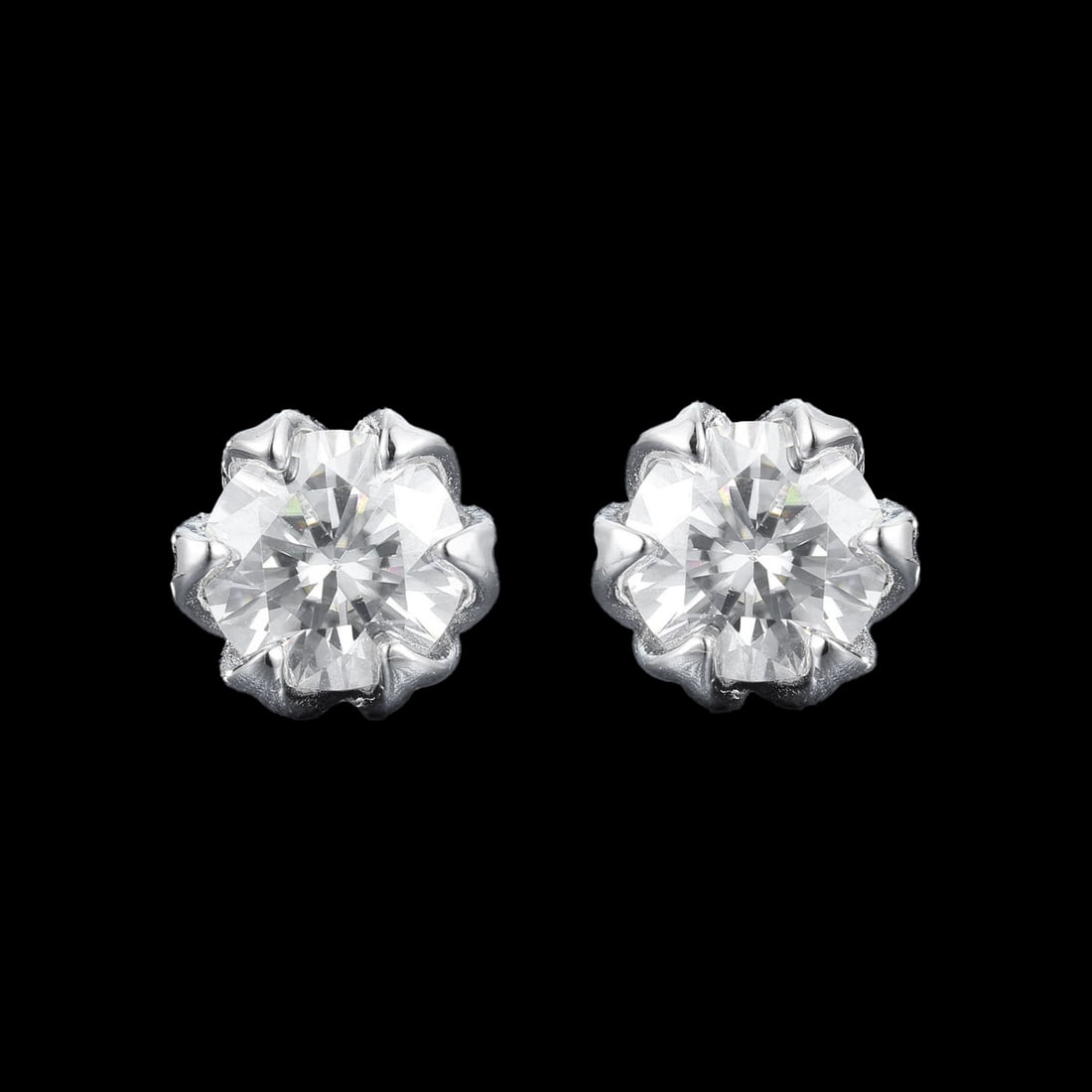 Classic Style Sterling Silver Moissanite Rose Stud Earrings: Size: Height 1.5 cm - Length 1.1 cm - Width 1.1 cm. Weight 3.23 g. Materials: 925 sterling silver, moissanite Condition: New These elegant stud earrings feature a meticulously crafted floral