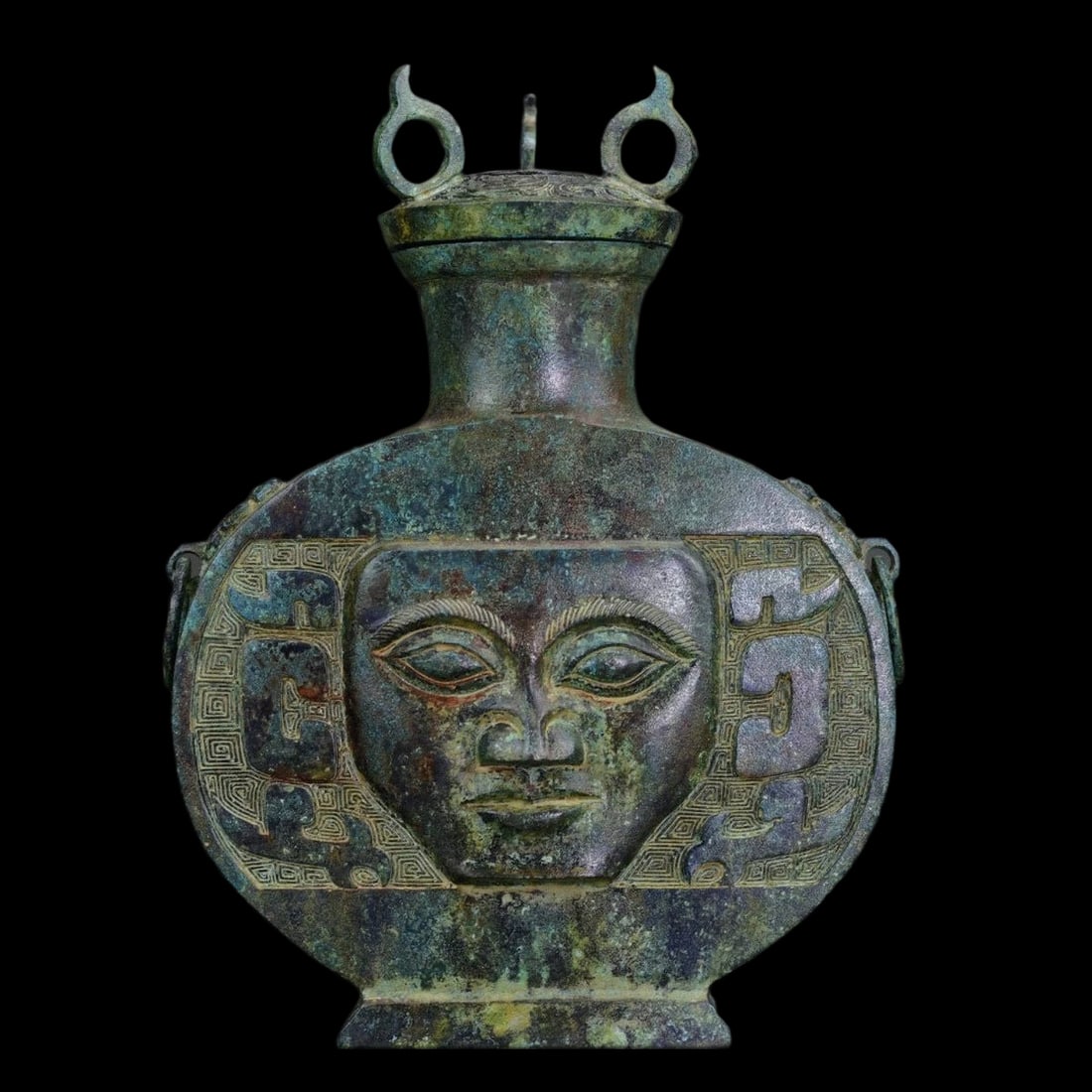 Chinese Vintage Style Bottle Face Mask Pattern: Size: Height 27.9 cm - Length 20.8 cm - Width 9.9 cm. Weight 3.2 kg. Materials: Bronze. Condition: Looks like vintage. This vessel is cast in bronze, with a classic "Vase" (Hu) silhouette with a rhyth