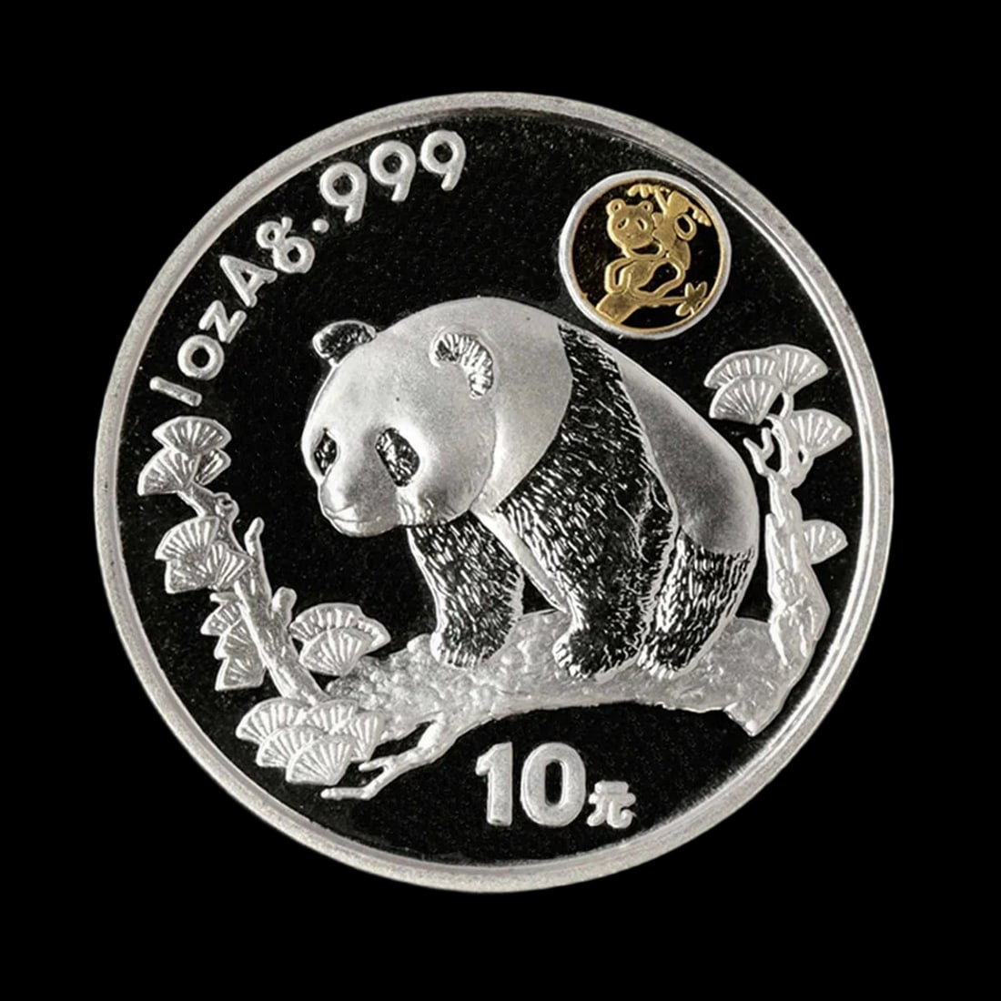 Retro Silver Panda Ginkgo Leaves Gold Inset Coin: Size: Diameter 4 cm - Thickness 0.3 cm - Width 4 cm. Weight 31.1 g. Materials: Silver Condition: New The obverse exhibits a meticulously sculpted panda perched atop a textured branch adorned with deli