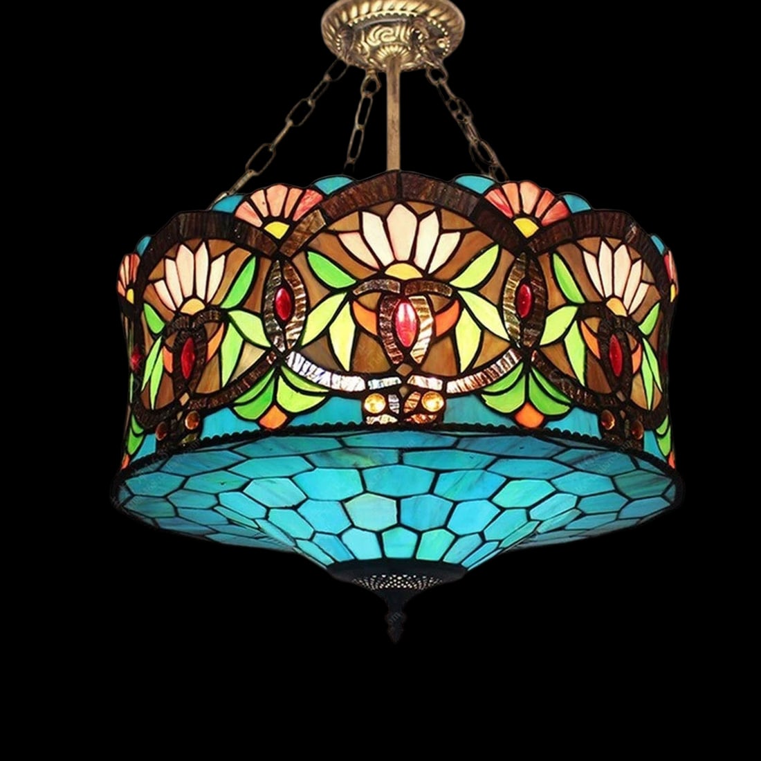 Hanging Chandelier Tiffany Style Geometric Flowers: Size: Width 50 cm - Height 46 cm. Materials: Stained glass, metal. Condition: New. This Tiffany-style chandelier is a masterfully crafted lighting fixture with a bold structural profile that adds a so