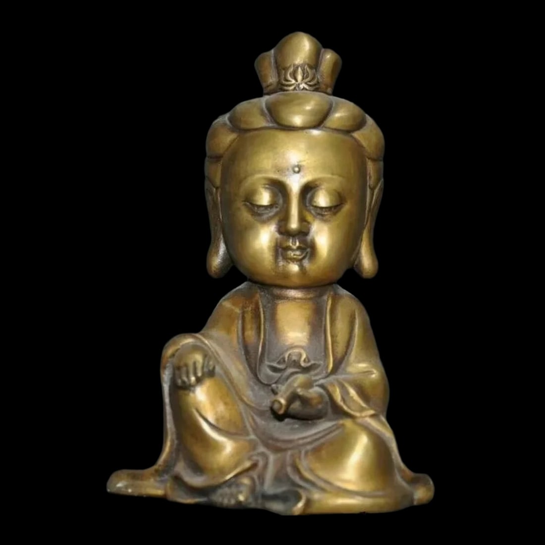 Antique Style Bronze Guanyin Wealth Sculpture: Size: Height 18.5 cm - Length 11.5 cm - Width 9 cm. Weight 1.0 kg. Materials: Bronze, metal. Condition: Resembles a retro aesthetic. This bronze statue depicts the Bodhisattva Guanyin, seated in a