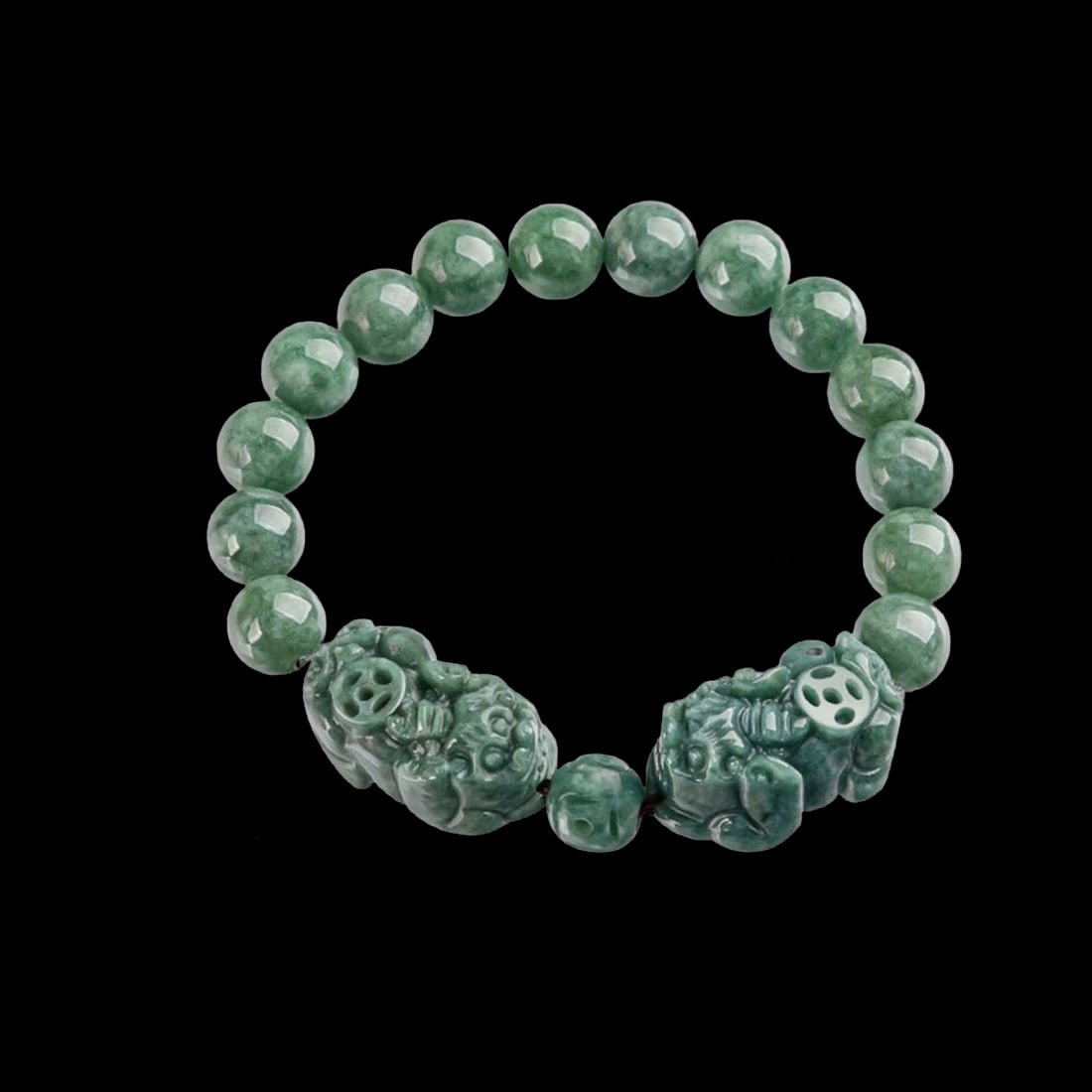 Greenish Jade Bracelet Wealth Protection Symbols: Size: Bead's diameter 1 cm. Pixiu's length 2.6 cm - Width 0.5 cm - Thickness 1.2 ?m. Materials: Jade. Condition: Appears to have a classic aesthetic. The bracelet is composed of round, polished beads