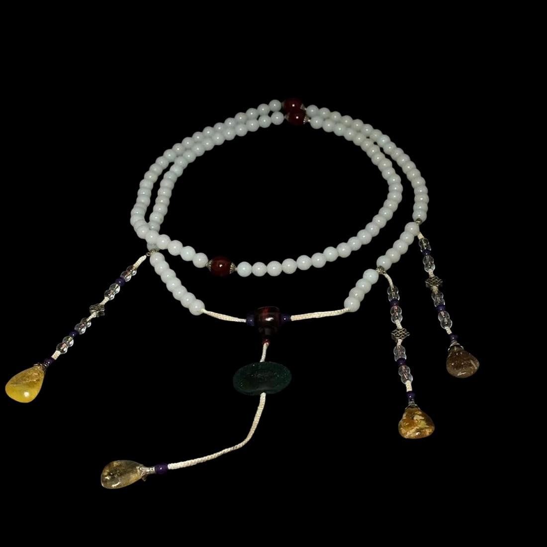 White Jade Necklace Red Silver Accents Pendants: Size: Length 90.81 cm. Weight 370 g. Number of beads 108. Materials: Jade. Condition: Appears to have a classic aesthetic. The necklace consists of several strands of homogeneous spherical beads in th