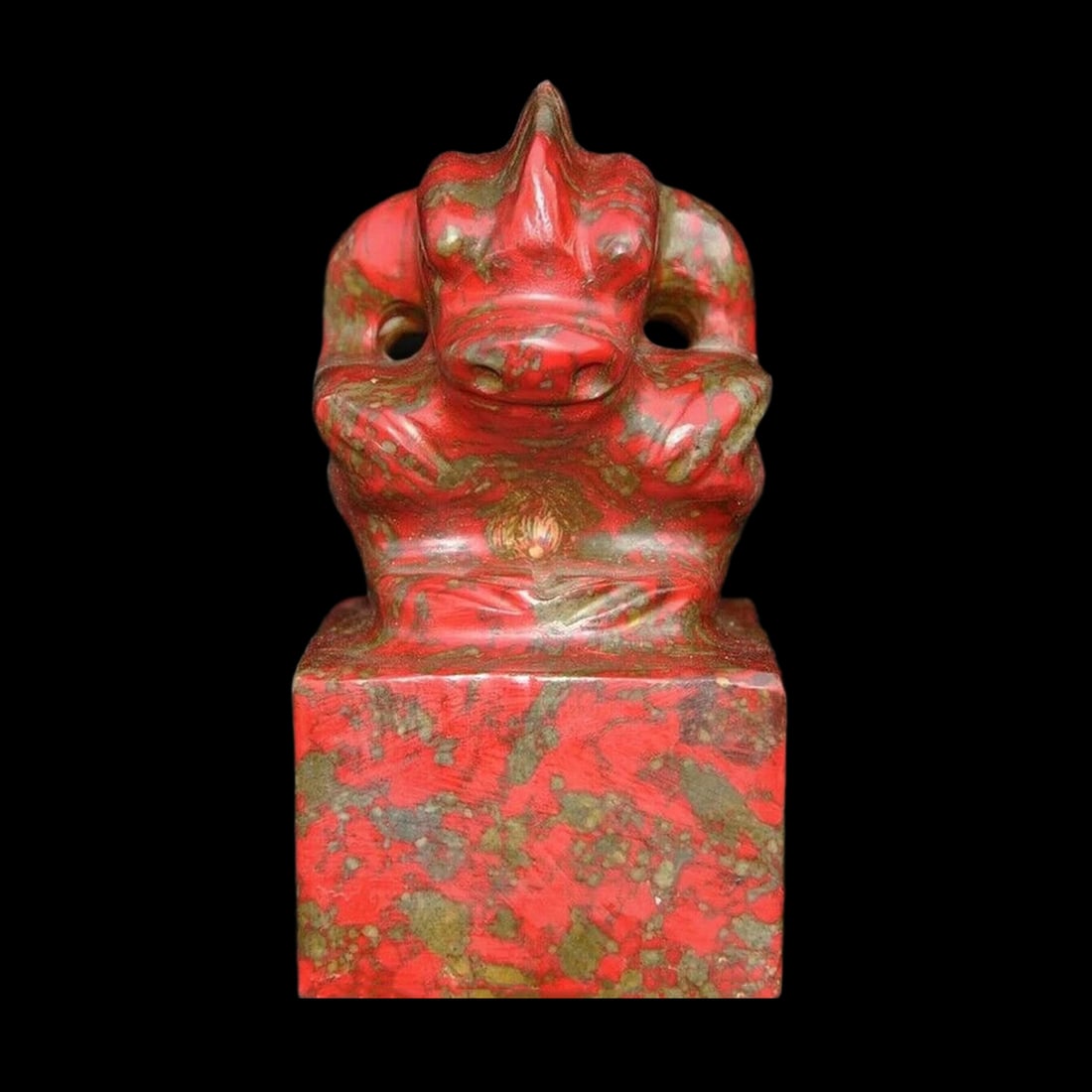Old Style Hongshan Jade Mythic Beast Head Stamp: Size: Height 15.0 cm - Length 8.5 cm - Width 7.5 cm. Weight 1.7 kg. Materials: Red jade. Condition: Looks like vintage. This piece is crafted in the style of a monumental ritual artifact, carved from