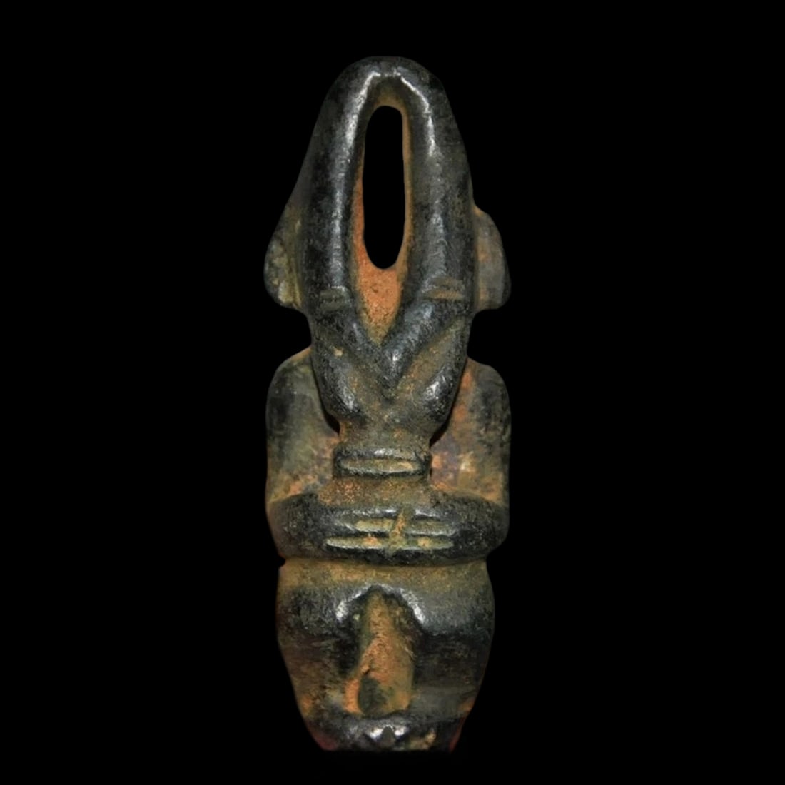 Black Jade Hand-Carved Sun God Helios Motif Statue: Size: Height 9 cm - Length 3.5 cm - Width 2 cm. Weight 200 g. Materials: Jade Condition: Excellent The figure presents a highly stylized, elongated silhouette characterized by smooth, rounded outer co