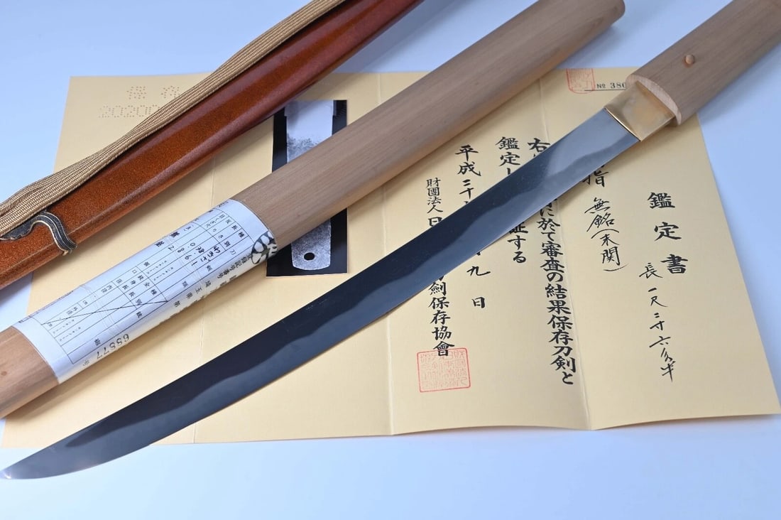 Handmade Tamahagane Steel Sue Seki Notare Gunome Wakizashi Shirasaya: Size: Overall Length 49.8 cm - Blade Length 38.6 cm - Koshirae Length 65.8 cm - Curvature 0.8 cm - Moto-Haba 2.86 cm - Saki-Haba 2.44 cm - Moto-Kasane 0.68 cm - Saki-Kasane 0.56 cm. Materials: Tamahag