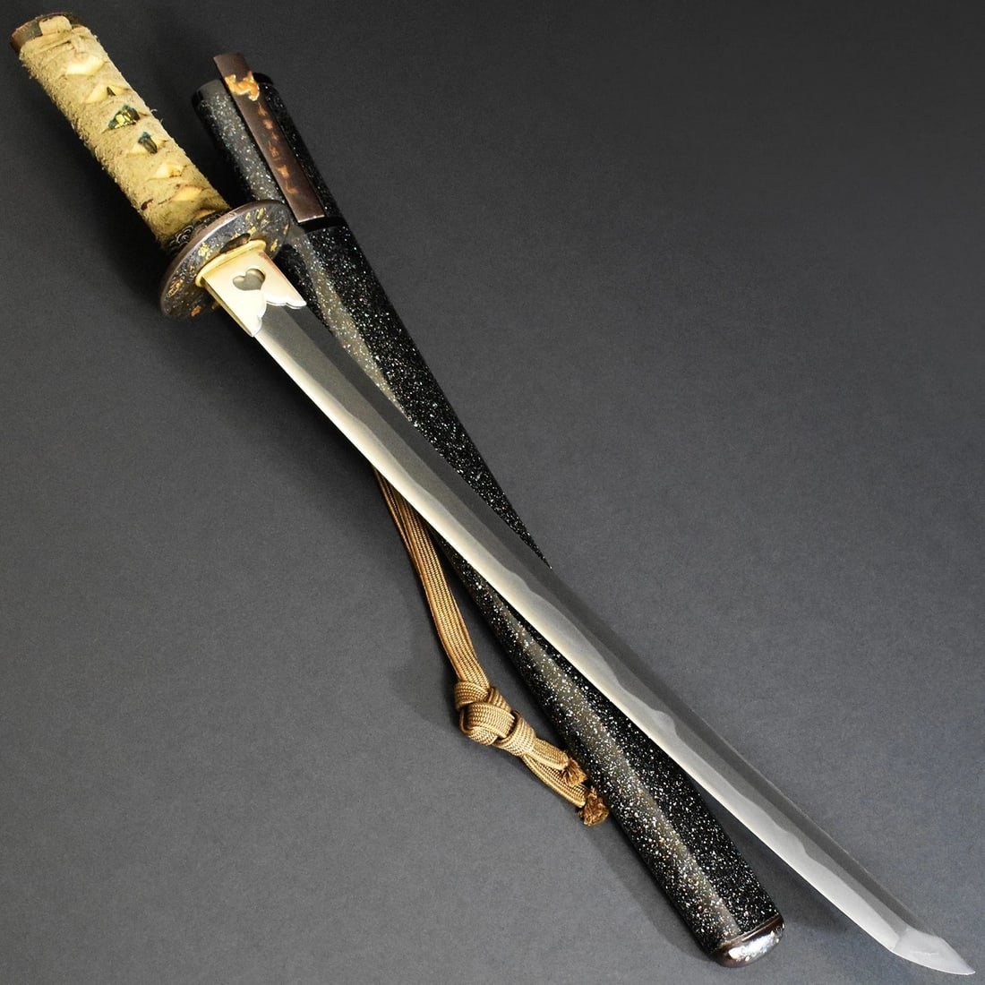 Handmade Tamahagane Steel Inome Heart Cutout Habaki Wakizashi Scabbard: Size: Overall Length 61 cm - Blade Length 39.9 cm - Curvature 0.8 cm - Blade Weight 458 g. Materials: Tamahagane steel Condition: Excellent (normal signs of wear) This wakizashi blade exhibits a grace