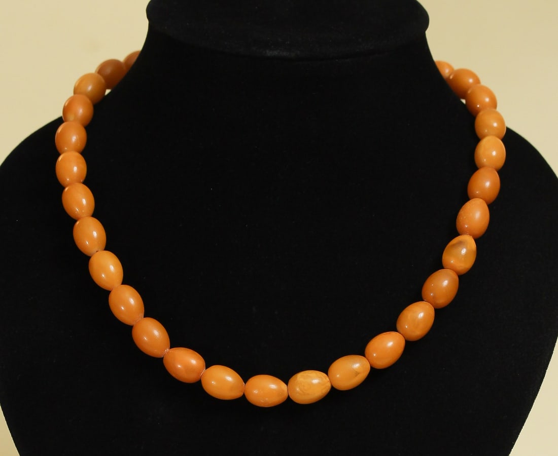 Butterscotch Baltic Amber Yellow Necklace Jewelry: 33g natural Baltic amber necklace in butterscotch, egg yolk, and royal amber colors, featuring a vintage Art Deco antique design. Weight: 33 grams (1.16 oz) Bead size: 9-10 mm Length: 470 mm Stone: 10