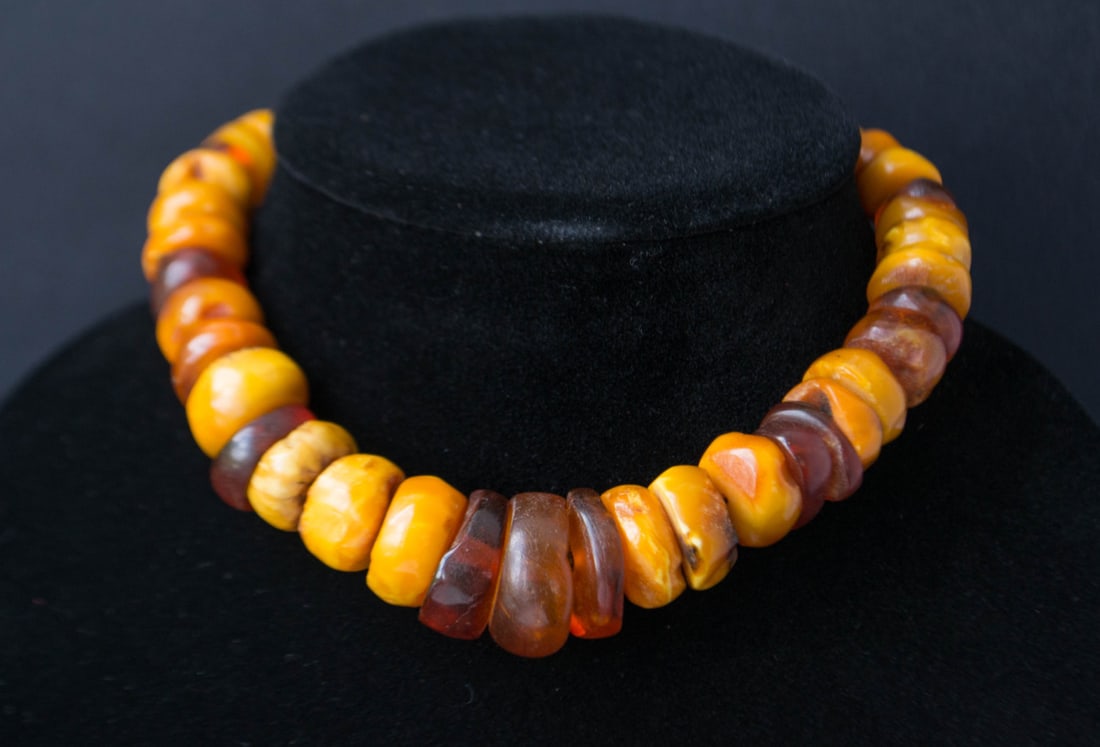 Golden Era Baltic Resin Beads: Authentic Butterscotch & Egg Yolk Hues: 67g vintage necklace made from 100% natural Baltic amber butterscotch egg yolk color. A timeless piece that showcases the rich and natural beauty of genuine amber. Weight: 67 gram Beads size:10-24 mm.
