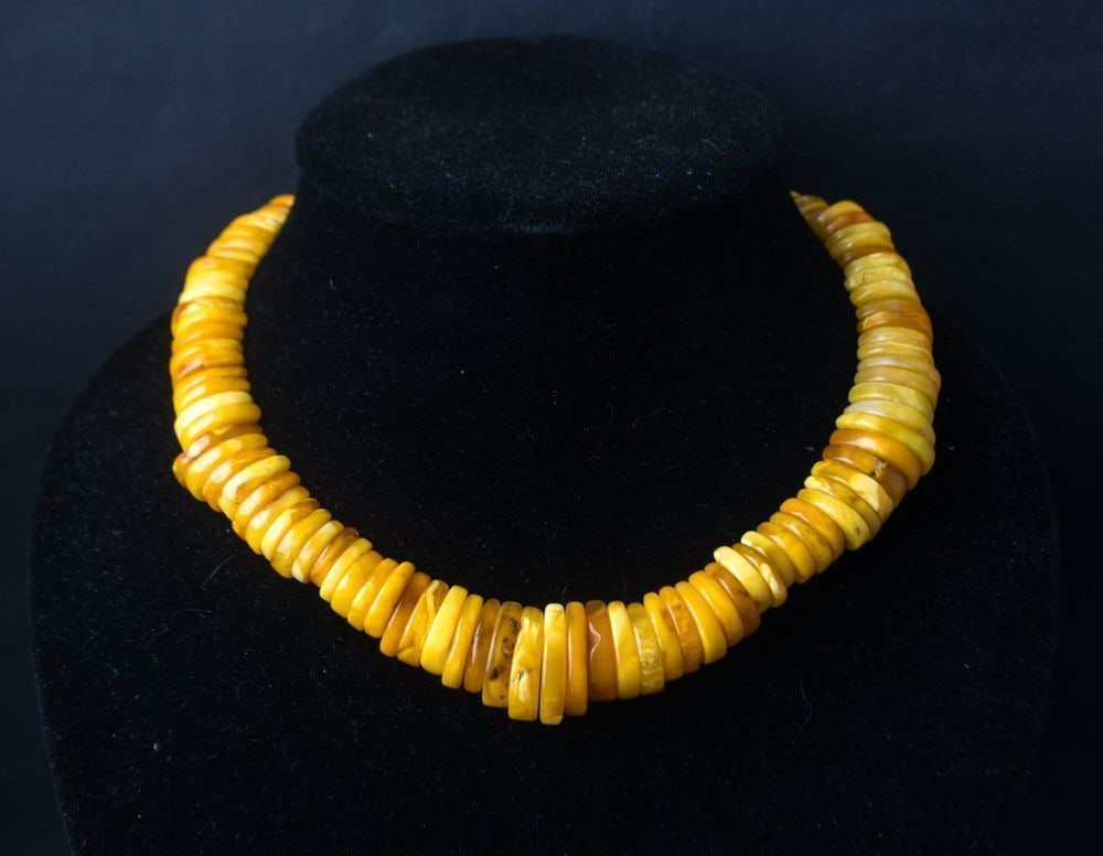 Antique 100% Natural Baltic Amber Necklace with Egg Yolk Beads: This vintage Baltic amber necklace, weighing 47g, is crafted from 100% natural amber and boasts a classic design, highlighting the timeless elegance of authentic amber. Weight: 47 gram (1.65 oz.) Bead