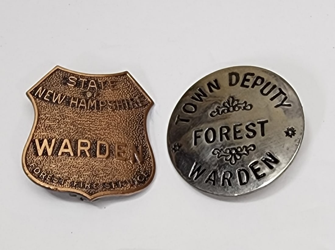 Lot of 2 Forest Fire Warden Badges: Lot of 2 forest fire warden badges to include:State of New Hampshire measuring 1 1/2" by 1 1/2". This badge is made of brass. The second badge is Town Deputy Forest Warden and its origin is unknown. T