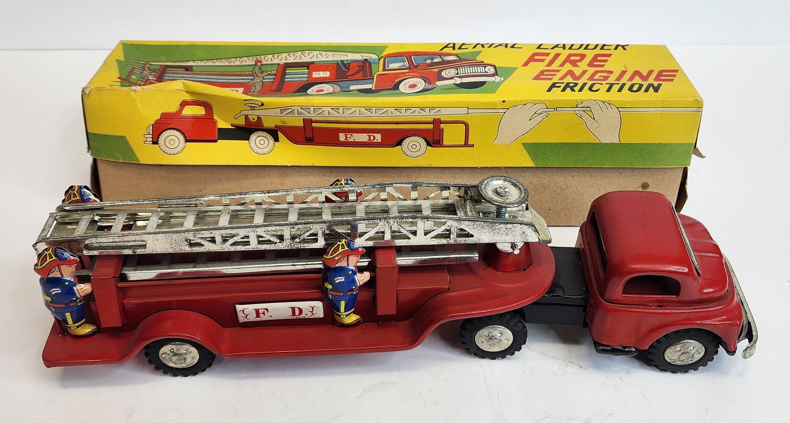 Tin Friction Ladder Fire Truck: Tin friction ladder truck, made in Japan 11 in with original box