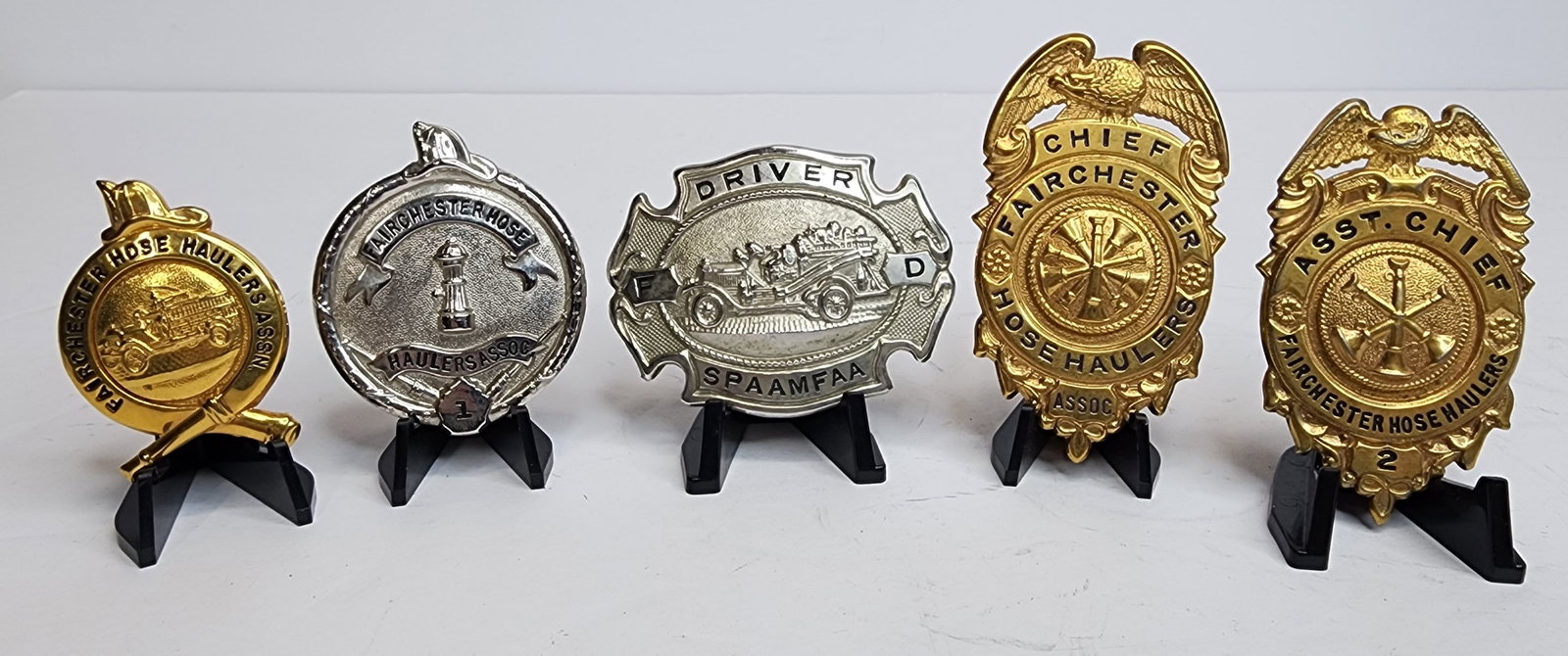 Lot of Fairchester Hose Haulers Badges: Lot of 4 various badges from the Fairchester Hose Haulers Chief, Driver, ect
