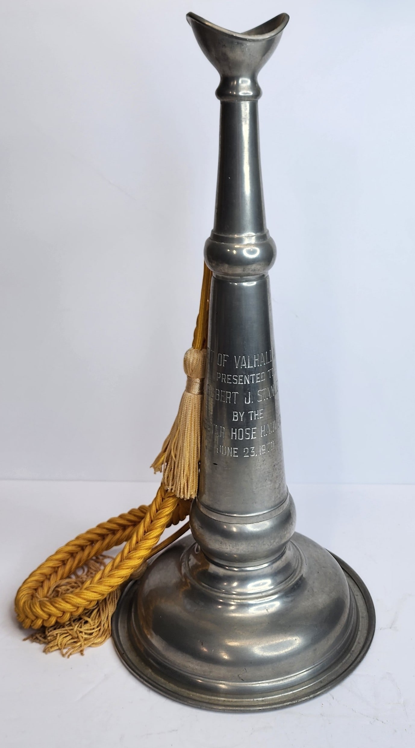 Firefighter Presentation Trumpet: Presentation trumpet from the Valhalla Muster in 1979. Presented to Gilbert J. Stanley by the Fairchester Hose Haulers 1979. Measures 19" tall