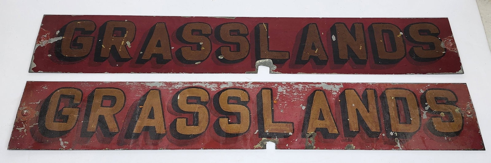 Grassland New York Fire Engine Plates: Pair of painted metal plates from a fire engine that served in the Grasslands New York. These are painted tin measuring 4" by 24" each.