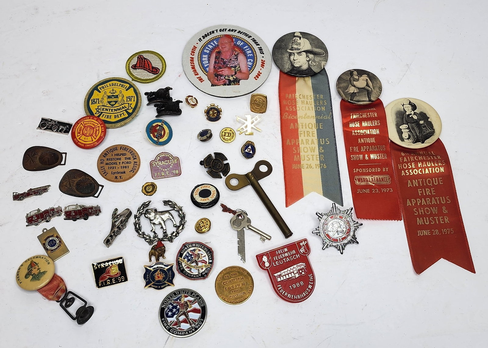 Large lot of Firefighting Pins and Buttons: Large lot includes Mack, New York Fire Association, Syracuse, Fairchester Hose Haulers, ect