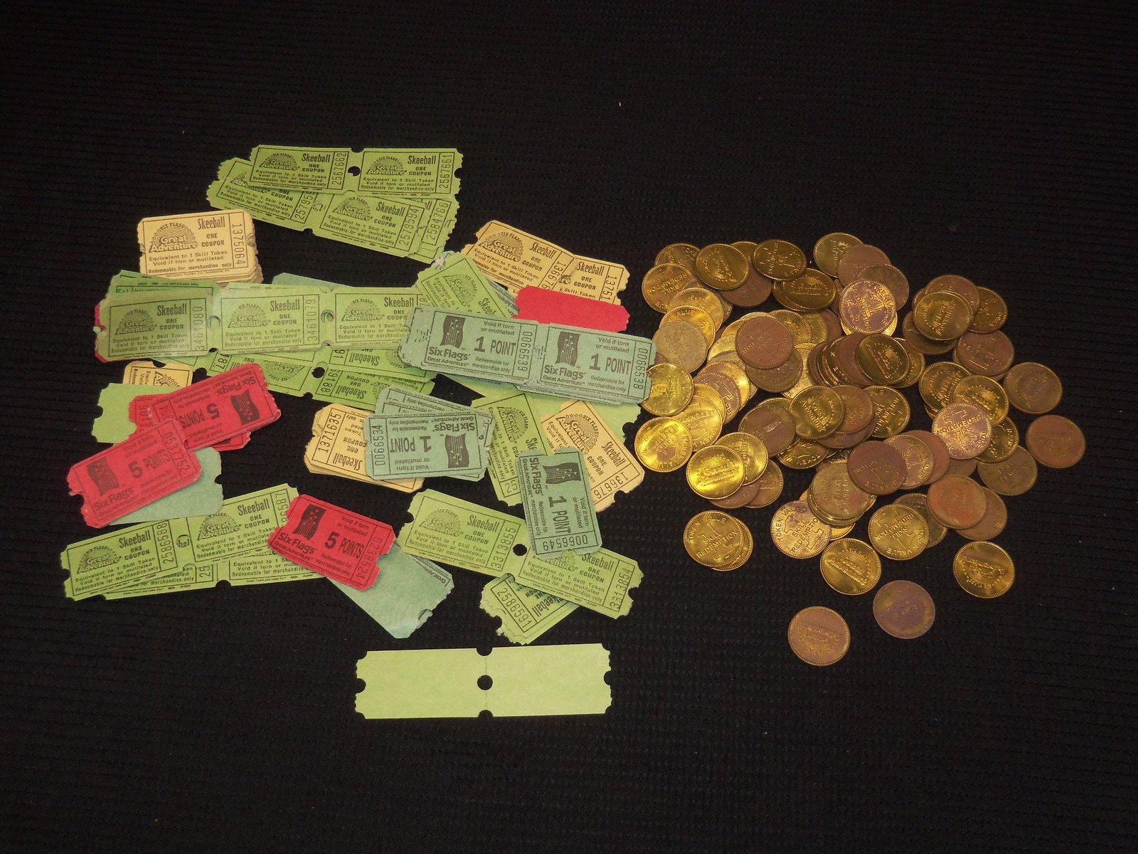 SIX FLAGS GREAT ADVENTURE TICKETS AND TOKENS: Lot of 99 tokens and tickets for Six Flags Great Adventure.