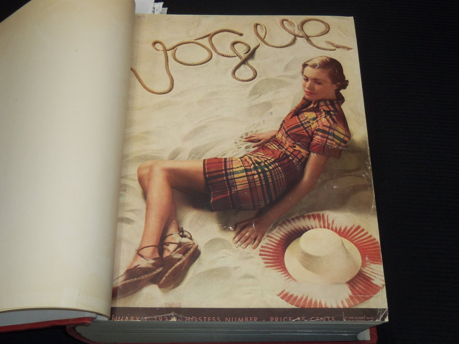 1934 JANUARY-JUNE VOGUE MAGAZINE BOUND VOLUME - GREAT COVERS - ADS: This is a bound volume of Vogue magazine from January-June 1934. There are a total of 12 issues, all of the covers are present. This is an ex-library volume, we did notice some pages excised from the 