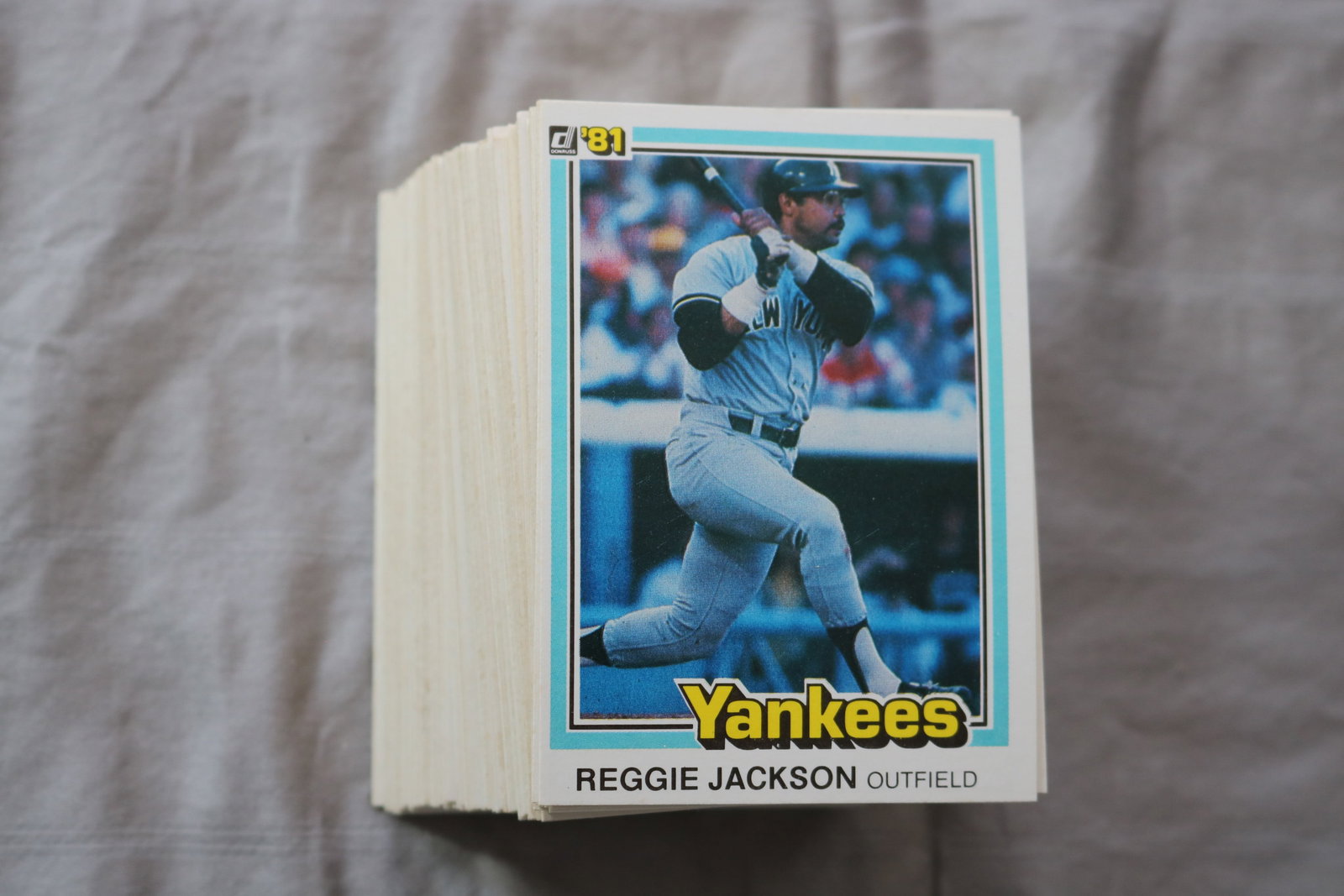 REGGIE JACKSON 1981 DONRUSS BASEBALL CARDS - CARD #348 - NEAR MINT TO MINT CONDITION - LOT OF 140: This is a lot of 140 1981 Reggie Jackson Donruss, card number 348, baseball cards. The cards are in near mint to mint condition.