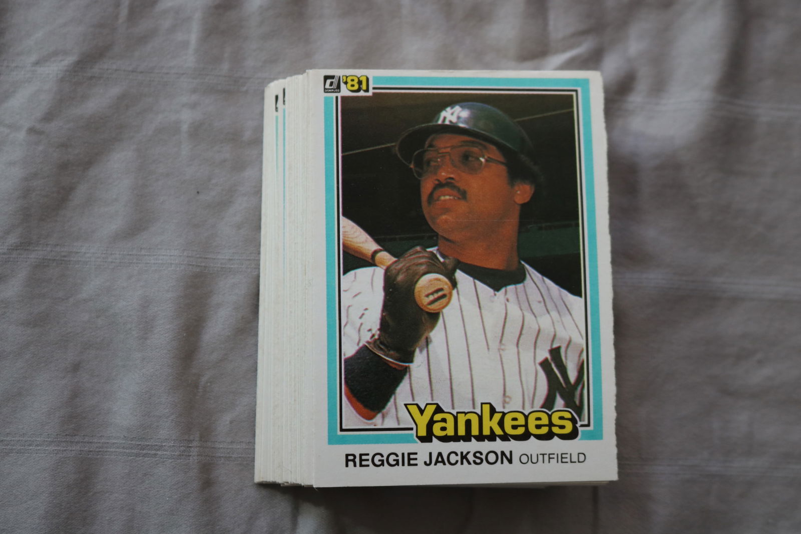 REGGIE JACKSON 1981 DONRUSS BASEBALL CARDS - CARD #228 - NEAR MINT TO MINT CONDITION - LOT OF 46: This is a lot of 46 1981 Reggie Jackson Donruss, card number 228, baseball cards. The cards are in near mint to mint condition.