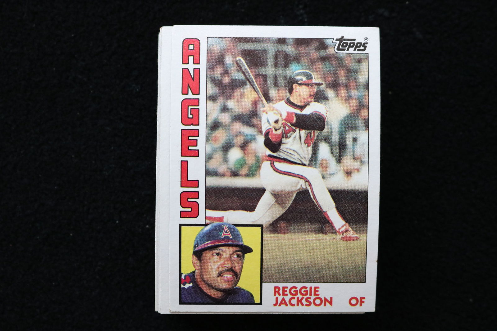 REGGIE JACKSON 1984 TOPPS BASEBALL CARDS - CARD #100 - NEAR MINT TO MINT CONDITION - LOT OF 50: This is a lot of 50 Reggie Jackson 1984 Topps, card number 100, baseball cards. The cards are in near mint to mint condition.