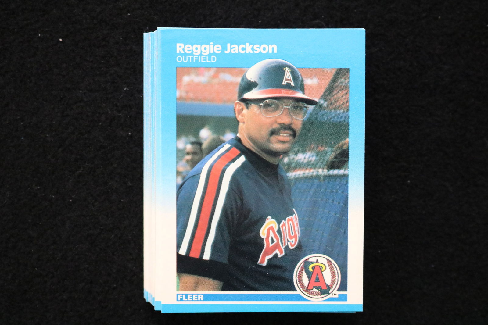 REGGIE JACKSON 1987 FLEER BASEBALL CARDS - CARD #84 - NEAR MINT TO MINT CONDITION - LOT OF 49: This is a lot of 49 Reggie Jackson 1987 Fleer, card number 84, baseball cards. The cards are in near mint to mint condition.