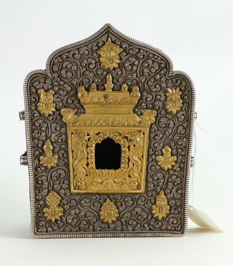 Buddhist silver coloured metal GAU shrine: High: Buddhist silver coloured metal GAU shrine: High quality piece with gilt decoration, measuring 18.5cm x 14cm x 6.5cm deep.
