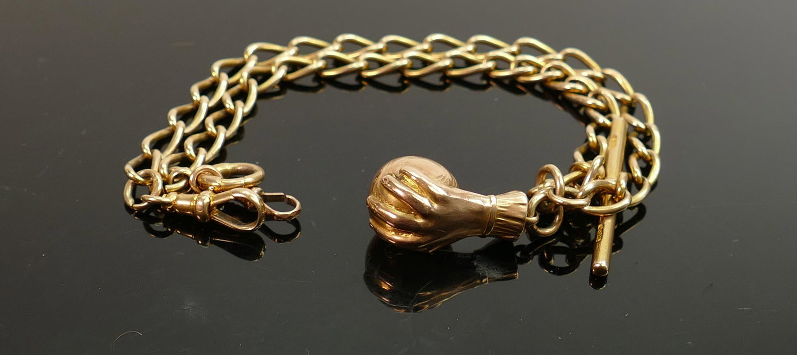 9ct double Albert watch chain: With 9ct T-bar & 9ct: 9ct double Albert watch chain: With 9ct T-bar & 9ct Riley Arms bowling ball and hand medal dated 1914, 34.6g.