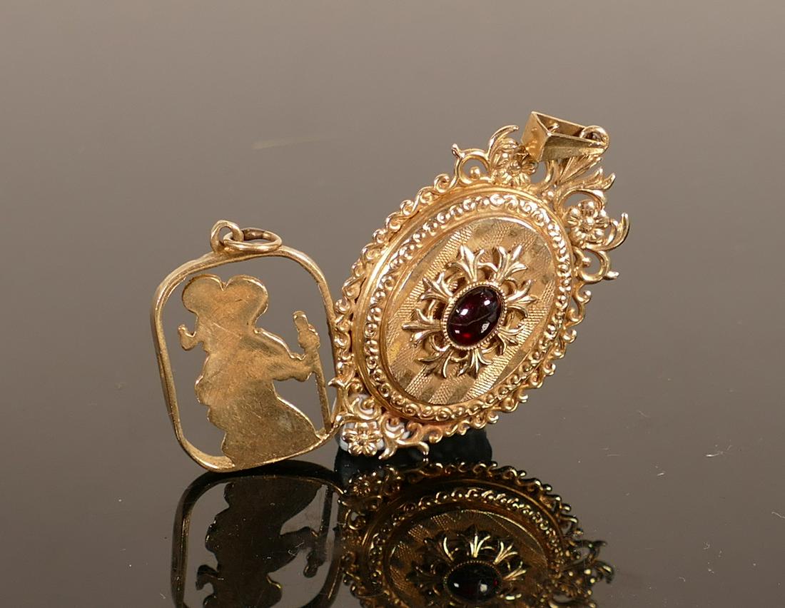 9ct gold locket set garnet & St Christopher pendant:: 9ct gold locket set garnet & St Christopher pendant: Locket measures 50mm overall. Gross weight 10.6g.