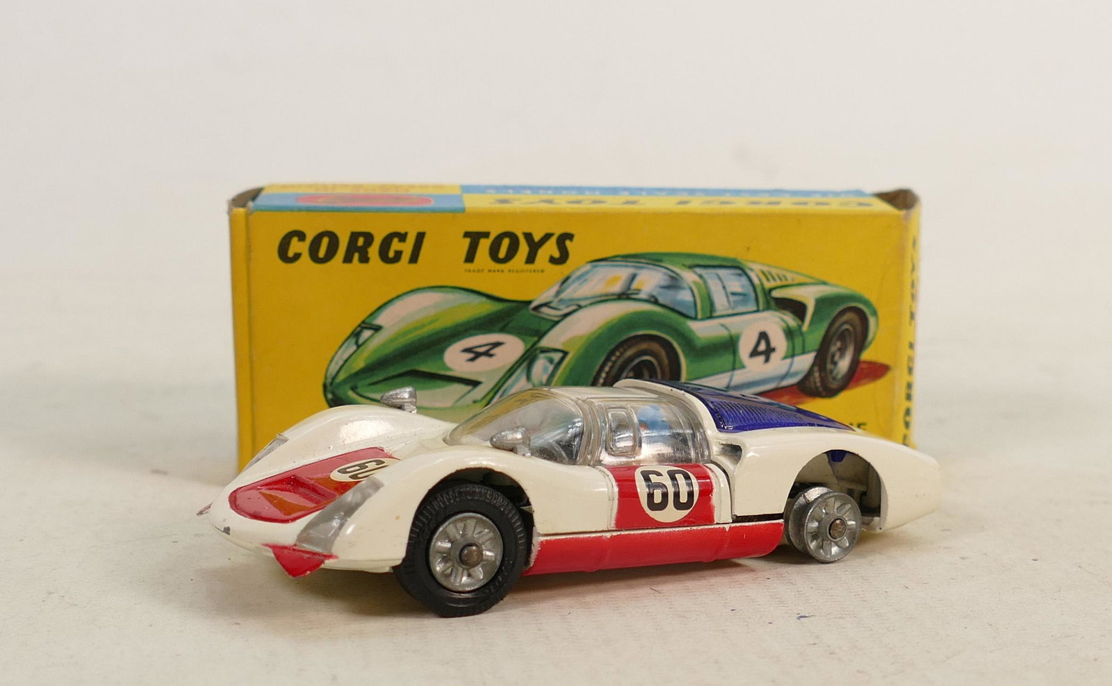 Corgi Porsche Carrera 6 model 330 boxed and near mint: Corgi Porsche Carrera 6 model 330 boxed and near mint condition: Tiny paint chip to car front, and loss of surface to small area of box on one end flap, and light crease