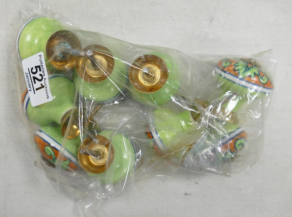 A set of colourfully decorated enamelled draw knobs: A set of colourfully decorated enamelled draw knobs (9):